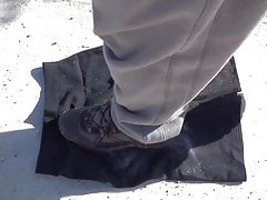 cleaning shoes on black skirt