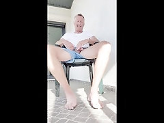 Naughty outdoor stroking and cum explosion in the courtyard.