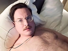 Hairy cub teases and fondles nipples in hotel room while masturbating on cam with his buddy, leading to a massive cumshot eruption