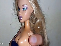 Kinky blonde doll enjoys a creamy surprise in her mouth