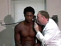Black stud undergoes physical examination by male doctor