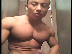 Asian muscle hunk guy shows off massive cock